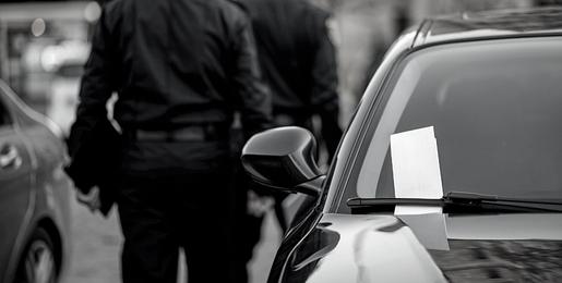 Parking Enforcement ticketing a car